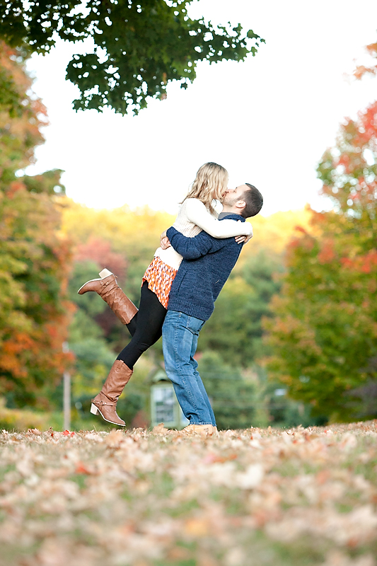 Engagement photo of guy picking up girl