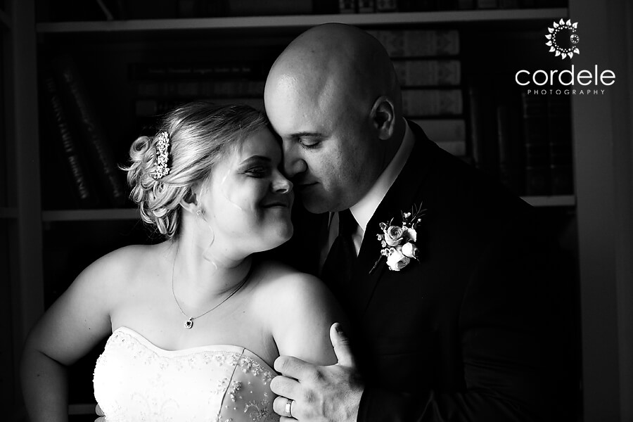 A black and white photo of a couple by a window at the Endicott Estate